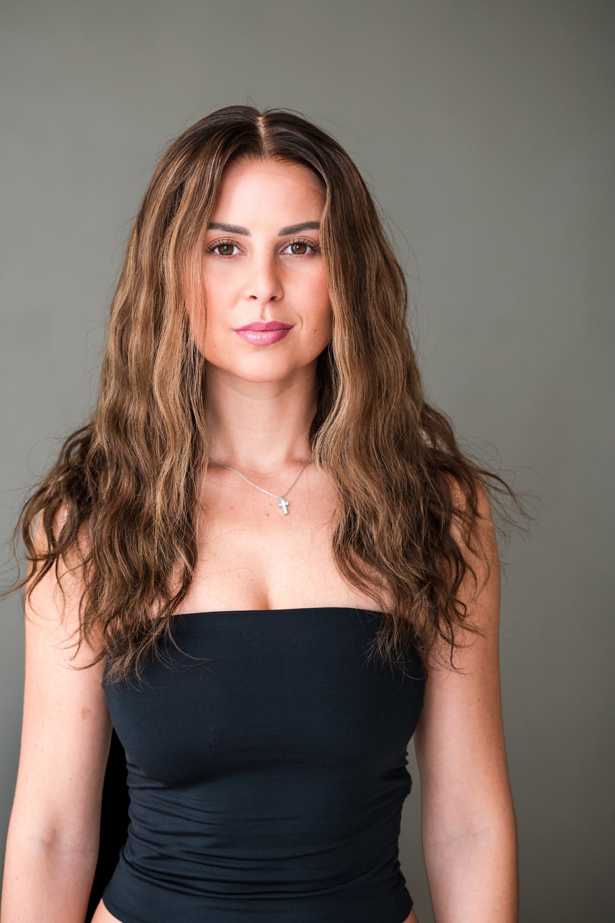 Bella Haire Alessia, a 14 inch warm brunette glueless HD lace wig with a natural wave