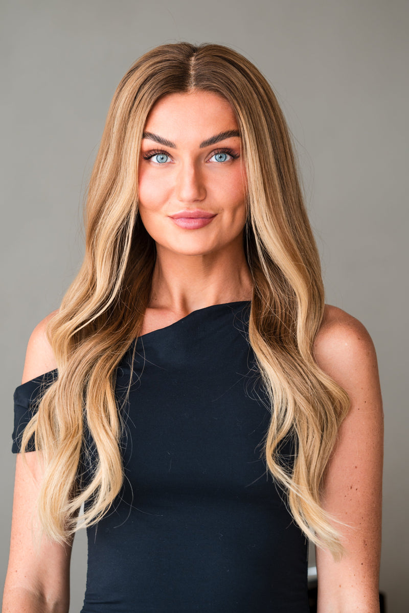 Bella Haire Eveline, a 20 inch warm highlighted blonde glueless HD lace wig, worn front-on